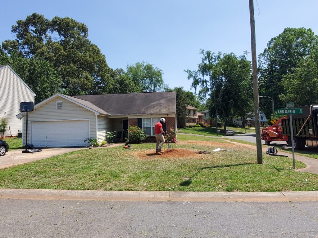 person covering up hole in the ground.